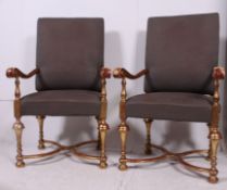 A pair of good quality large Gainsborough style elbow chairs each with shaped padded back rests and