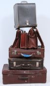 A good stack of vintage 20th century suitcases to include trunks, suitcases gentlemans attache case,