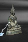 An early 20th century small bronze statue of a Buddha.