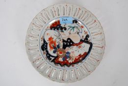 A Chinese 19th centuru porcelain plate having Imari pattern design with pierced ribbon style