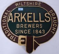 A vintage Arkells Draught of Wiltshire cast iron metal wall plaque.