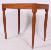 An early 20th century French Fruitwood writing table raised on fabulous reeded baluster legs with