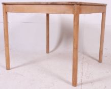 A retro contemporary upcycled square beech wood shabby chic dining table raised on turned supports