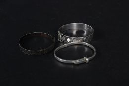 A collection of 3 ladies silver bracelets to include Edwardian rococo decorated,