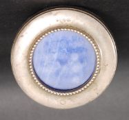 A silver hallmarked miniature porthole photo frame having an easel back.