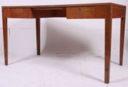A good Air Ministry oak large desk raised on square tapered legs having fitted drawers with large