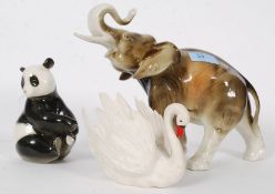 A 20th century pink mark Royal Dux Elephant, along with a USSR figurine of a panda,