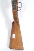 A 19th century British 20 bore percussion cap rifle.