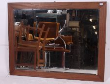 A large contemporary oak overmantel wall mirror dating to the Twentieth century having good  wooden