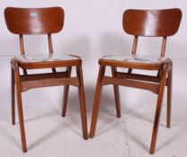 A pair of 1950's beech wood kitchenette dinette dining chairs having wonderful laminate upholstered