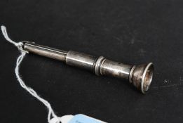 A white metal (stamped ' sterling ' indicating silver ) cigar pricker, with moving poker to top.