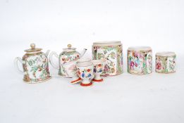 A collection of 19th century Cantonese oriental painted part tea service pieces,