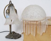 A 20th century Tiffany style table lamp complete with the shade having good coloured glass