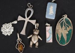 A collection of 7x silver / white metal pendants, to include a Wedgwood Jasperware cameo pendant,
