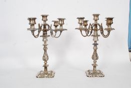 A pair of fabulous large oversized rococo silver plated candelabra having 4 branches to each with