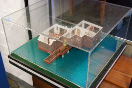 A table top architectural / architects model display of a Malaysian chalet set within an acrylic