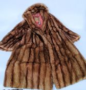 A vintage ladies 1950's fur  3/4 length coat having lined interior furriers retailers label for M