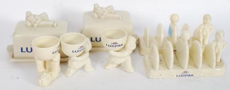 2 vintage retro Lurpak advertising butter dishes and stands together with 2 toast rack stands and 3