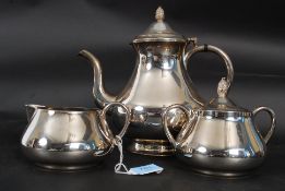 A 20th century silver plated part tea service comprising teapot, sugar,