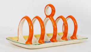 A Clarice Cliff Bizarre ' Crocus ' pattern five-bar toast rack, decorated in coloured enamels,