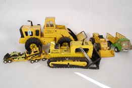 A collection of vintage Tonka toys to include Bulldozer,