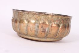 A 19th century Copper & Gilded bowl of Islamic  / Turkish origin having an etched scene