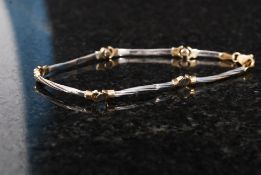 A 14ct gold ladies bracelet of naturalistic form, the yellow metal stamped '14k'. Weight: 6.