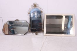 There decorative retro wall hanging mirrors to include deco, scroll work and wooden framed.