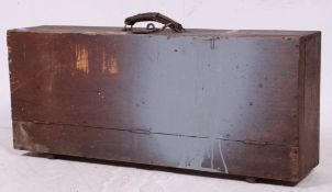 A vintage 20th century wooden carpenters tool box having tools within ( see illustration ).