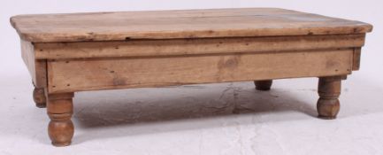 A 19th century Victorian pine coffee table ( reduced height dining table ) raised on turned legs