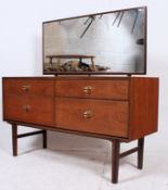A vintage 1960's teak 4 drawer retro dressing table with large mirror over teak chest on turned