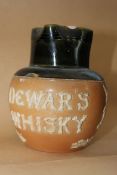 A Royal Doulton stoneware glazed Dewars Whisky pub stoneware jug wth impressed stamp to the base