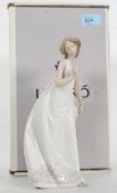 A boxed Lladro figure ' Afternoon Promenade complete with the box,