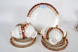 A Royal Stafford ' Morning Glory ' part tea service comprising cups, saucers,