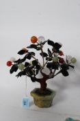A Chinese 20th century soapstone and glass bead adorned bonzai tree