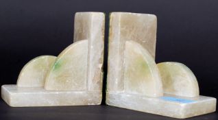 A pair of 1930's Art Deco Marble / Onyx bookends having demi lune style embellished marble mounts