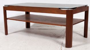 A retro vintage 1970's smoked glass and teak rectangular coffee table raised on squared base with