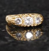 An 18ct gold 3 stone ladies diamond ring.