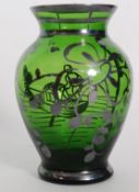 A silver overlaid green glass dump vase in the manner of Loetz.