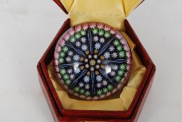 A Perthshire Glass domed millefiori paperweight being unsigned but came with Perthshire box.