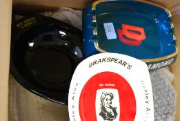 A collection of Twenty four pub advertising ashtrays.