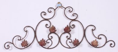 An ornate deorative metal work wall hanging coat rack. Measures: 44cm x 101cm.