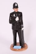 A Royal Doulton Classics figurine - HN4410 Policeman, modelled by Adrian Hughes - 24cm tall.