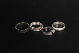 A collection of silver 925 marked contemporary ladies rings to include wave set eternity ring,