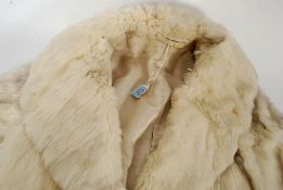 A vintage ladies 1950's white arctic fox ? fur  short coat having lined interior