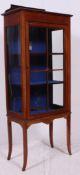 An Edwardian mahogany inlaid display cabinet.