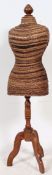 A 20th century rattan weave dress shop - tailors mannequin - 3/4 body raised on a mahogany tripod