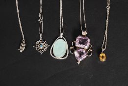 A collection of ladies silver necklaces to include a large stone set pendant,and chain,