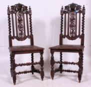 2 19th century Victorian carved oak and leather Carolean revival dining chairs.