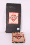 A vintage monopoly board game complete with the box having older style paper playing pieces ( see